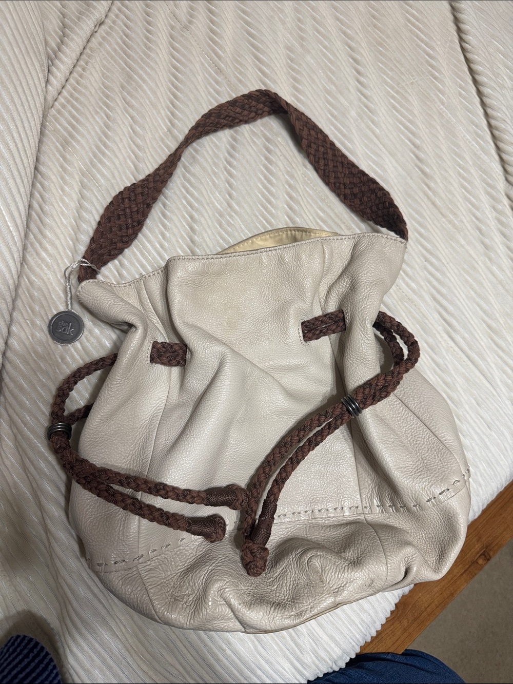 The Sak Cream Leather Drawstring Hobo with Brown Braided Straps